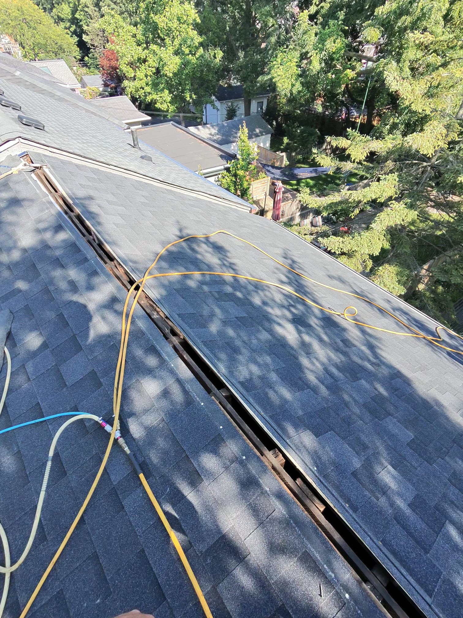 Keen Roofing crew performing residential roof tear-off and replacement